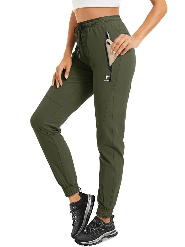 Woman wearing Travel Women's Quick-Drying Pants with Zippered Pockets, perfect for active adventures and outdoor comfort.
